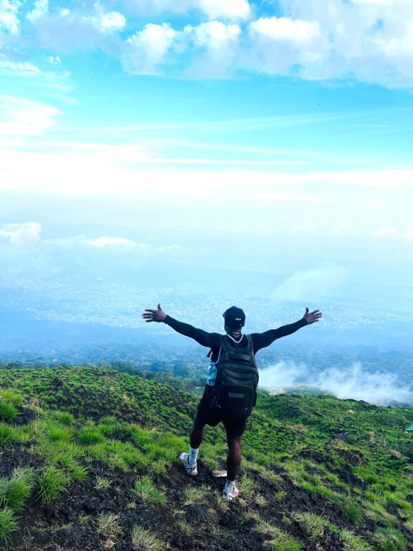 young mountain hiker happily descending mount Cameroon